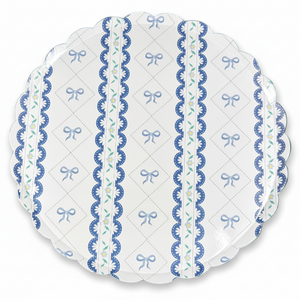 Close-up of blue bow scalloped paper plate design with floral details