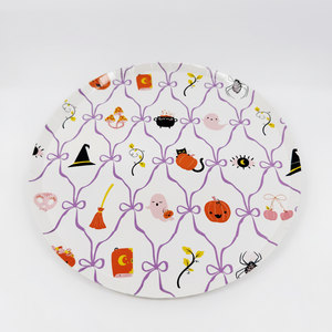 Decorative plate with Halloween-themed illustrations on a white background