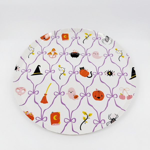 Decorative plate with Halloween-themed illustrations on a white background