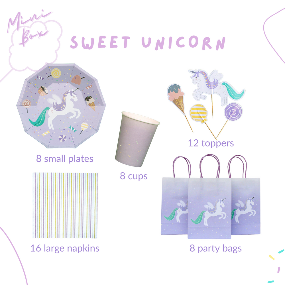 Unicorn-themed party supplies including plates and cups on a light background
